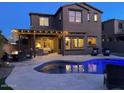 Stunning backyard oasis with a pool, patio, and pergola at 13428 S 186Th Ave, Goodyear, AZ 85338