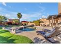 Relaxing pool and spa area with lounge chairs and patio furniture at 13428 S 186Th Ave, Goodyear, AZ 85338