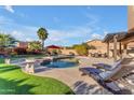 Inviting pool and patio with lounge chairs at 13428 S 186Th Ave, Goodyear, AZ 85338