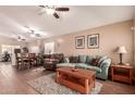 Spacious living room featuring a teal sofa and wood coffee table at 14749 N 153Rd Dr, Surprise, AZ 85379