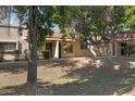 Front view of a charming single-story home with mature landscaping at 17242 N 16Th Dr # 9, Phoenix, AZ 85023