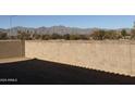 Landscaped backyard with block wall and mountain views at 17330 W Royal Palm Rd, Waddell, AZ 85355