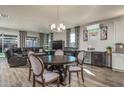 Open dining area with seating for six and large windows at 18147 W Sandy Rd, Goodyear, AZ 85338