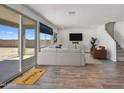 Bright and spacious living room with tile floors and sliding glass doors leading to backyard at 19436 W Valle Vista Way, Litchfield Park, AZ 85340