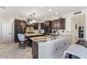 Spacious kitchen featuring granite countertops and modern cabinetry at 3141 S 83Rd Cir, Mesa, AZ 85212