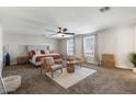 Large main bedroom with sitting area and plenty of natural light at 3141 S 83Rd Cir, Mesa, AZ 85212