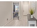 Bright entryway with wood-look tile floors and view of bedroom at 3189 N Excursion Ln, Casa Grande, AZ 85122