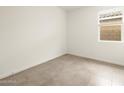 Neutral bedroom with tile floors, a window, and white walls at 3201 E Hayden Rose Ave, San Tan Valley, AZ 85143