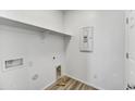 Laundry room with built in shelving and vinyl flooring at 37535 W Patterson St, Maricopa, AZ 85138