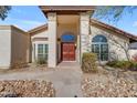 Front entry of a home with double doors and stone pathway at 408 W Straford Dr, Chandler, AZ 85225