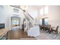 Bright dining room with hardwood floors and an open staircase at 4417 E Rancho Caliente Dr, Cave Creek, AZ 85331