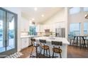 Modern kitchen with white cabinets, island, and stainless steel appliances at 4417 E Rancho Caliente Dr, Cave Creek, AZ 85331