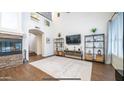 Spacious living room featuring a stone fireplace and built-in shelving at 4417 E Rancho Caliente Dr, Cave Creek, AZ 85331