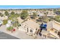 Scenic aerial view of a home in a vibrant community with lush greenery and desert landscaping at 4968 E Grandview Rd, Scottsdale, AZ 85254