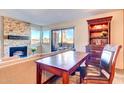 Living room with stone fireplace and built-in shelving at 5122 E Shea Blvd # 1029, Scottsdale, AZ 85254