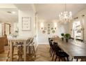 Bright dining room featuring a long wooden table and chandelier at 6740 N 7Th St, Phoenix, AZ 85014