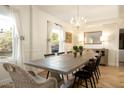 Elegant dining room with a large table and chandelier at 6740 N 7Th St, Phoenix, AZ 85014