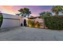 Front view of a single-story home with attached garage and gated entry at 7258 E Manzanita Dr, Scottsdale, AZ 85258