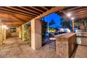 Outdoor patio area with a built-in brick bar and grill at 7258 E Manzanita Dr, Scottsdale, AZ 85258