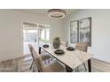 Bright dining room with marble table, sliding door to patio at 7870 W Cheryl Dr, Peoria, AZ 85345