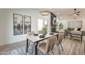 Elegant dining area with marble table and modern chairs at 7870 W Cheryl Dr, Peoria, AZ 85345