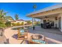 Relaxing pool area with patio furniture and fire pit at 8602 E San Alfredo Dr, Scottsdale, AZ 85258