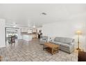 Open concept kitchen with stainless steel appliances and island at 9518 W Shasta Dr, Sun City, AZ 85351