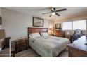 Main bedroom with wood furniture and a ceiling fan at 9735 W Ironwood Dr # A, Peoria, AZ 85345