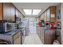 Galley kitchen with stainless steel appliances and granite counters at 9735 W Ironwood Dr # A, Peoria, AZ 85345