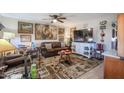 Cozy living room featuring a leather sofa and large TV at 9735 W Ironwood Dr # A, Peoria, AZ 85345