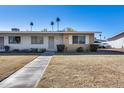 Single story home with brick facade and small front yard at 10863 W Thunderbird Blvd, Sun City, AZ 85351