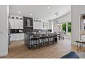 Modern kitchen with white cabinets and large island at 14035 E Sahuaro Dr, Scottsdale, AZ 85259
