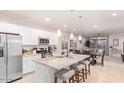Spacious kitchen island with granite countertops at 17536 W Desert Bloom St, Goodyear, AZ 85338