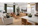 Open concept living room with hardwood floors and neutral decor at 20622 N 226Th Ln, Surprise, AZ 85387