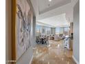 Elegant entryway with hardwood floors and a large format artwork at 2211 E Camelback Rd # 1202, Phoenix, AZ 85016