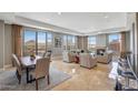 Open living area with hardwood floors and city views at 2211 E Camelback Rd # 1202, Phoenix, AZ 85016