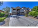 Two-story house with a three-car garage and driveway at 23116 N 41St St, Phoenix, AZ 85050