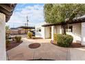 Building exterior with walkway, parking area, and landscaping at 2400 N 71St St # T, Scottsdale, AZ 85257