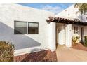 White stucco exterior, private entrance, and landscaping at 2400 N 71St St # T, Scottsdale, AZ 85257