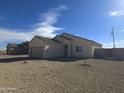 Single story home featuring desert landscaping, a two-car garage, and neutral color palette at 26293 W Desert Crest St, Casa Grande, AZ 85193