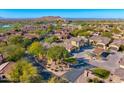 Bird's-eye view of a residential neighborhood near a golf course at 3190 S Jacaranda Ct, Gold Canyon, AZ 85118
