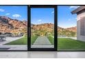Glass doors open to a scenic mountain view at 4129 E Sandy Mountain Rd, Paradise Valley, AZ 85253