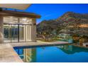 Luxury pool with mountain views and outdoor seating area at 4129 E Sandy Mountain Rd, Paradise Valley, AZ 85253