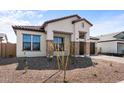 Charming one-story house featuring desert landscaping, stone accents, and a tile roof at 42103 N Cutbow Trl, San Tan Valley, AZ 85140