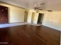 Open living area with dark hardwood and tile flooring at 5019 W Roma Ave, Phoenix, AZ 85031