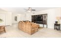 Living room with brown sectional sofa and built-in entertainment center at 5648 W Folley St, Chandler, AZ 85226