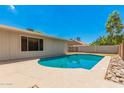 Inviting kidney-shaped pool with a stone border at 5648 W Folley St, Chandler, AZ 85226