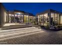 Modern home exterior with illuminated entryway stairs at 7223 N Black Rock Trl, Paradise Valley, AZ 85253