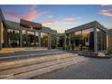 Modern home with illuminated entryway and glass walls at 7223 N Black Rock Trl, Paradise Valley, AZ 85253