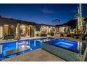 Luxury resort style pool and spa with fire pit and outdoor seating at 7223 N Black Rock Trl, Paradise Valley, AZ 85253